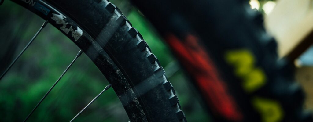 a close up of a bike tire with a blurry background